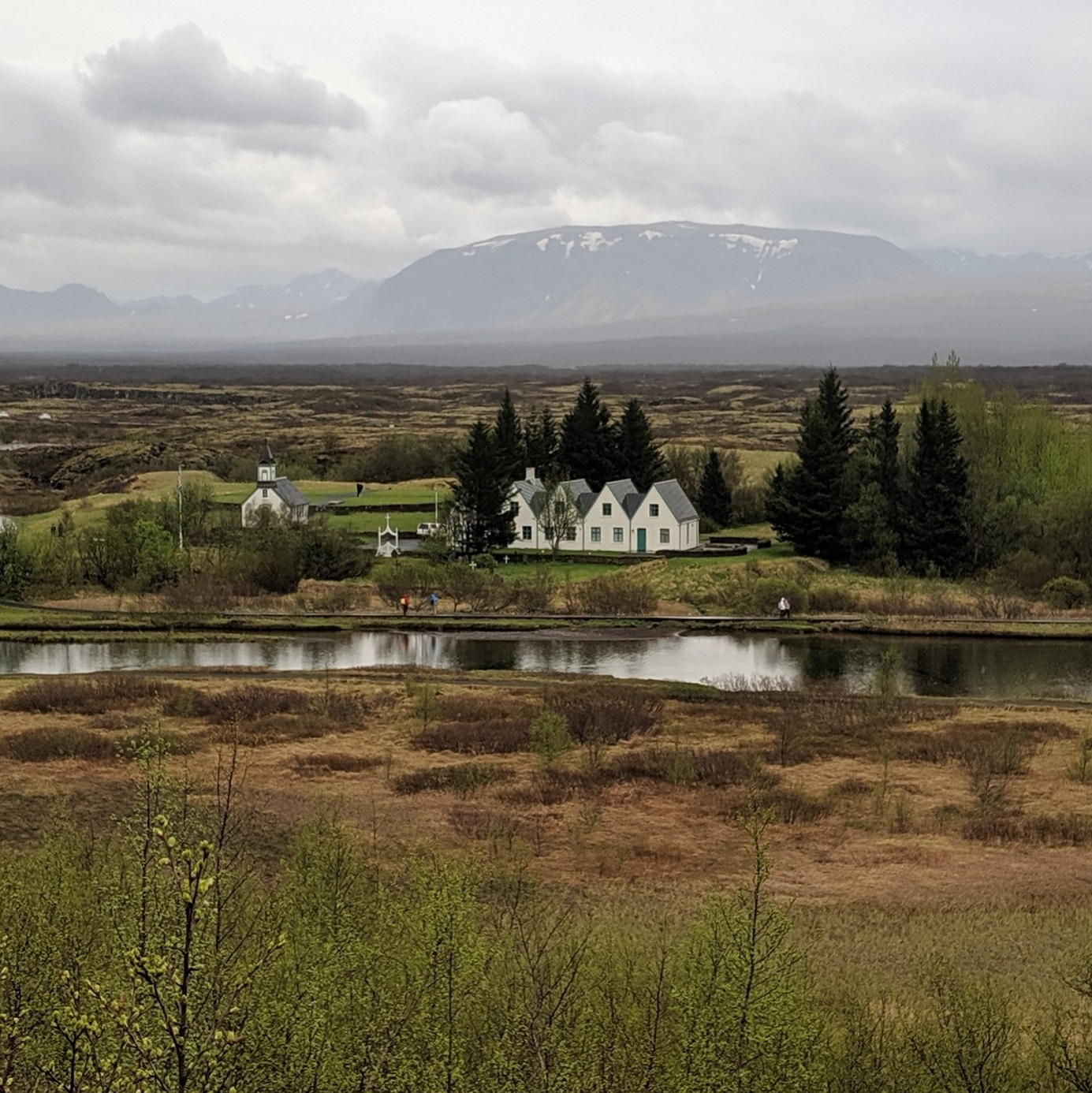 little houses and church across the river