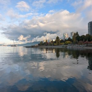 Sunset Beach and West End reflected in water
