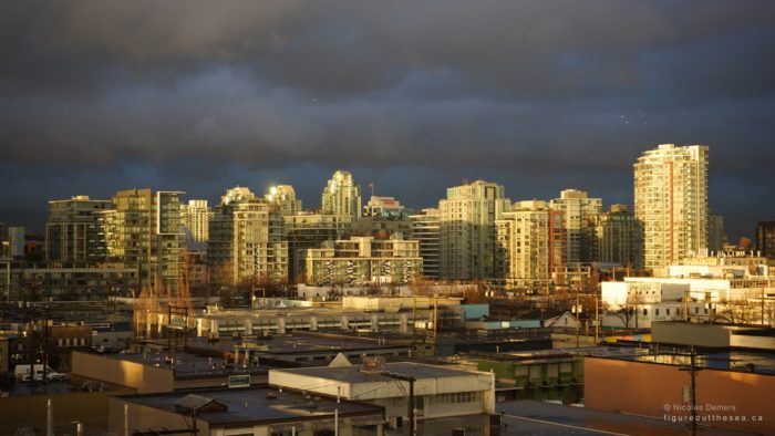 Gold buildings under clouds