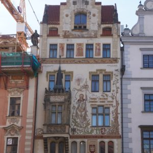 A house with a Gothic balcony and elaborately painted façade