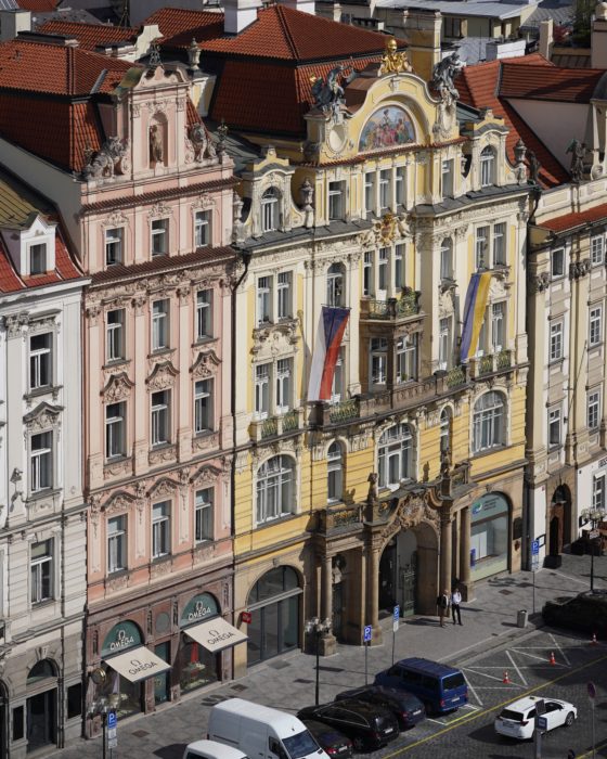 Pink and yellow buildings by the Old Town Square