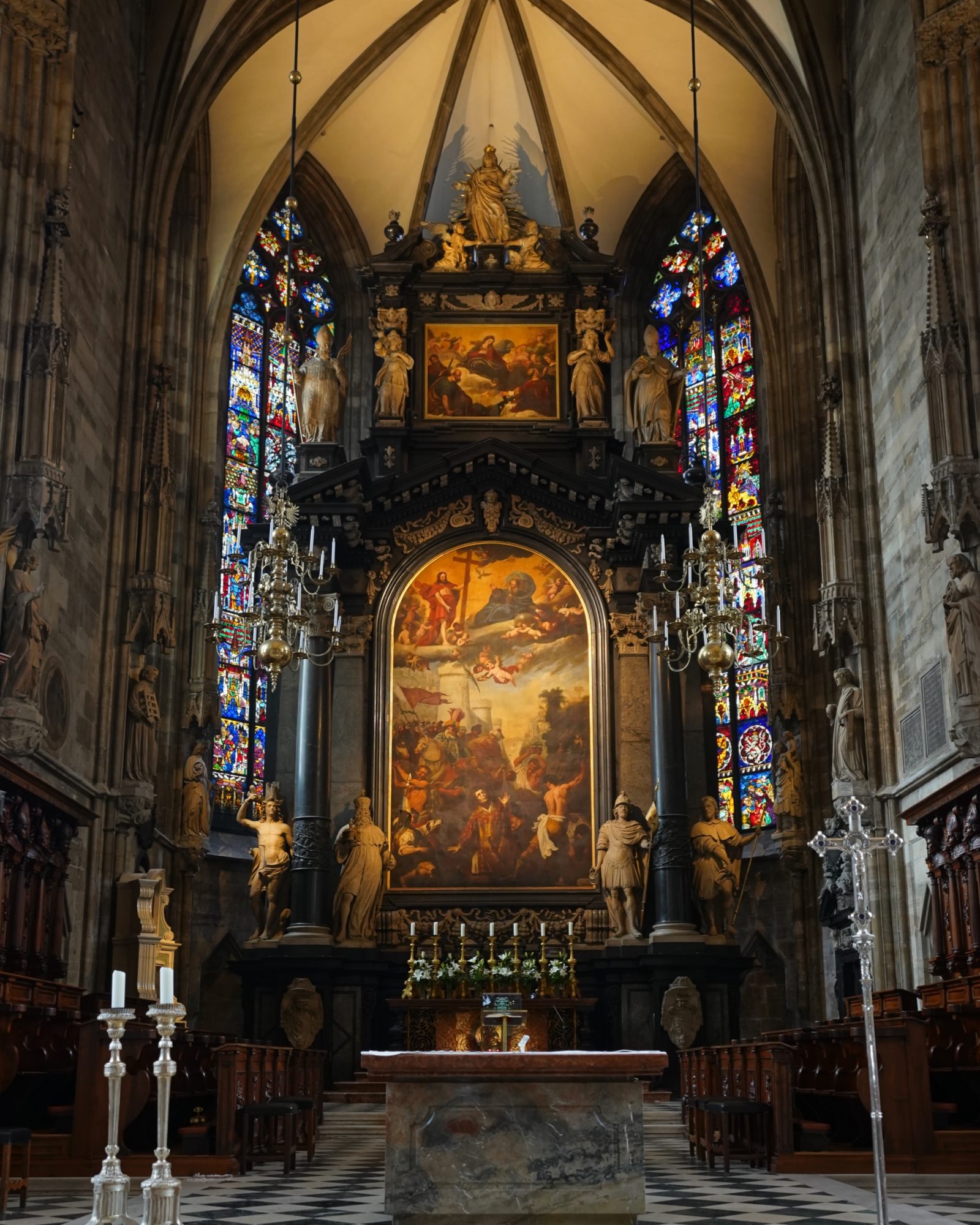 St. Stephen's High Altar: behind it is a big painting of St. Stephen framed in black marble, surrounded by stained glass and statues