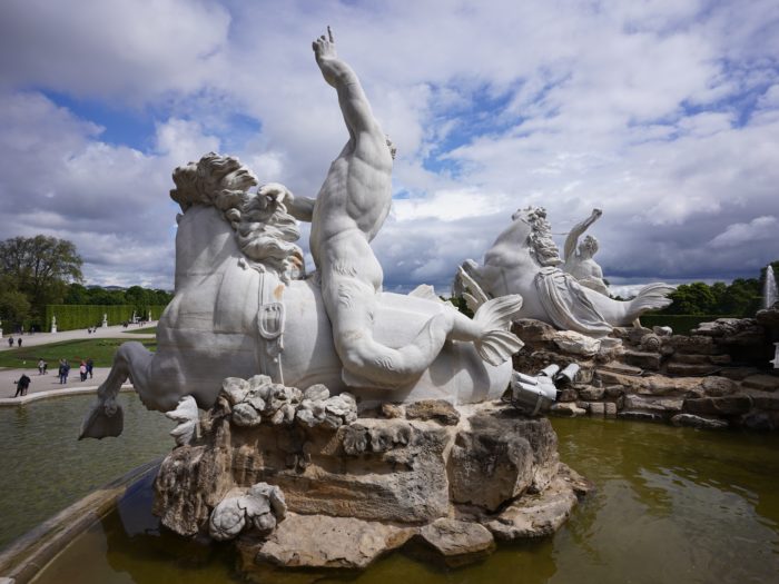 A mer-man statue riding a mer-horse
