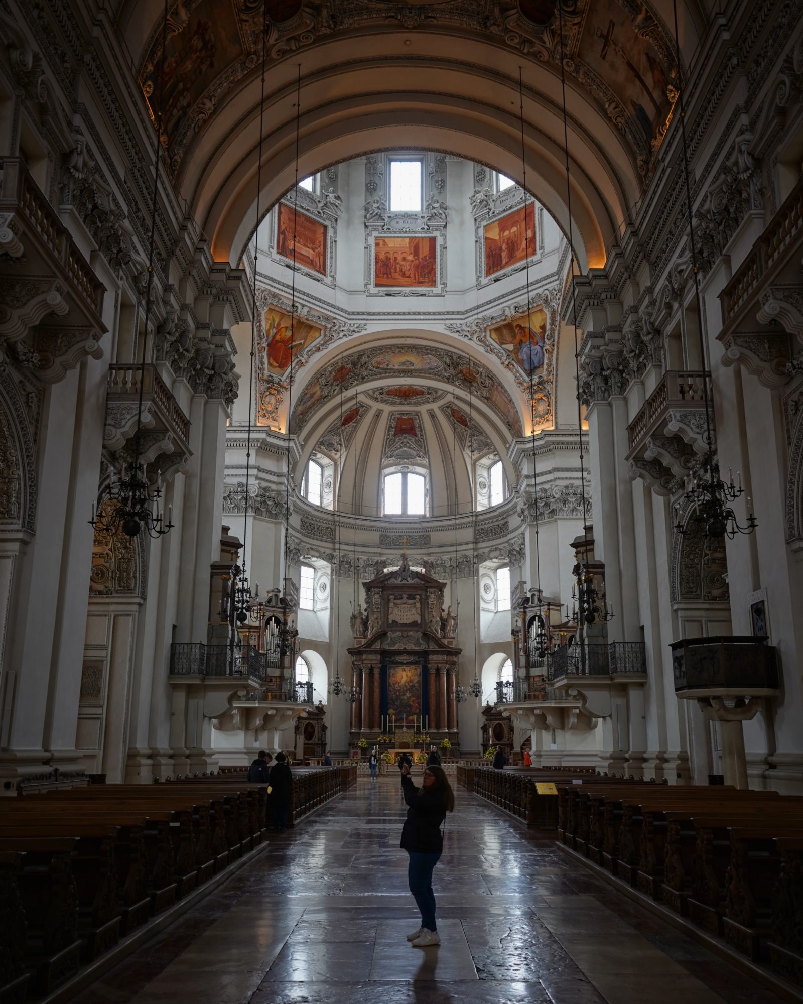 Shooting inside Salzburg Cathedral. Someone else is in the centre of the aisle also taking a picture with their phone
