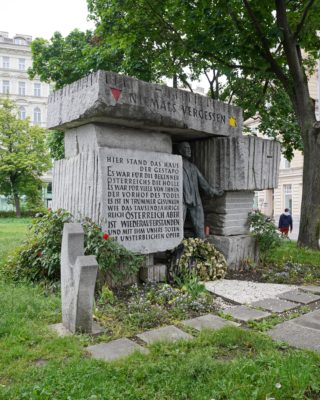 A public monument: cinderblocks and a concentration camp victim escaping