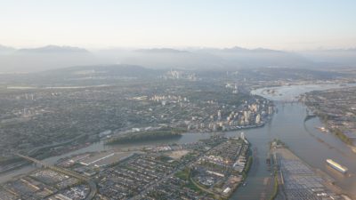 New Westminster and Surrey, with the Fraser River separating them