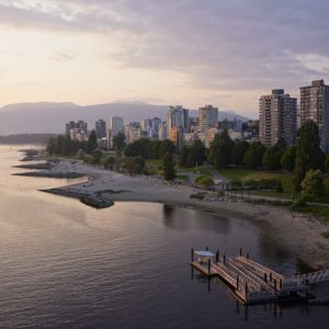 A view of Sunset Beach and the West Endat sunset, from Burrard Bridge. The sky is gold and indigo