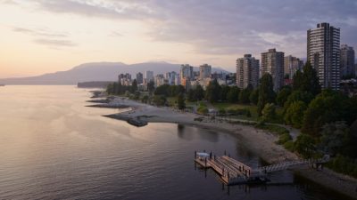 A view of Sunset Beach and the West Endat sunset, from Burrard Bridge. The sky is gold and indigo
