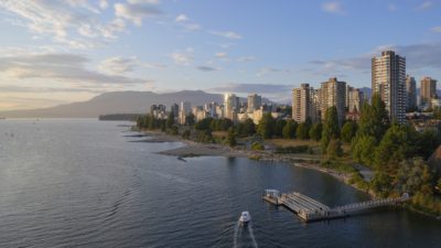 Sunset Beach and West End towers, late afternoon. The sky is blue, with some clouds