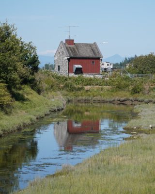 The Maple Street Pumphouse, a small house at the end of the little slough on one end of Blackie Spit