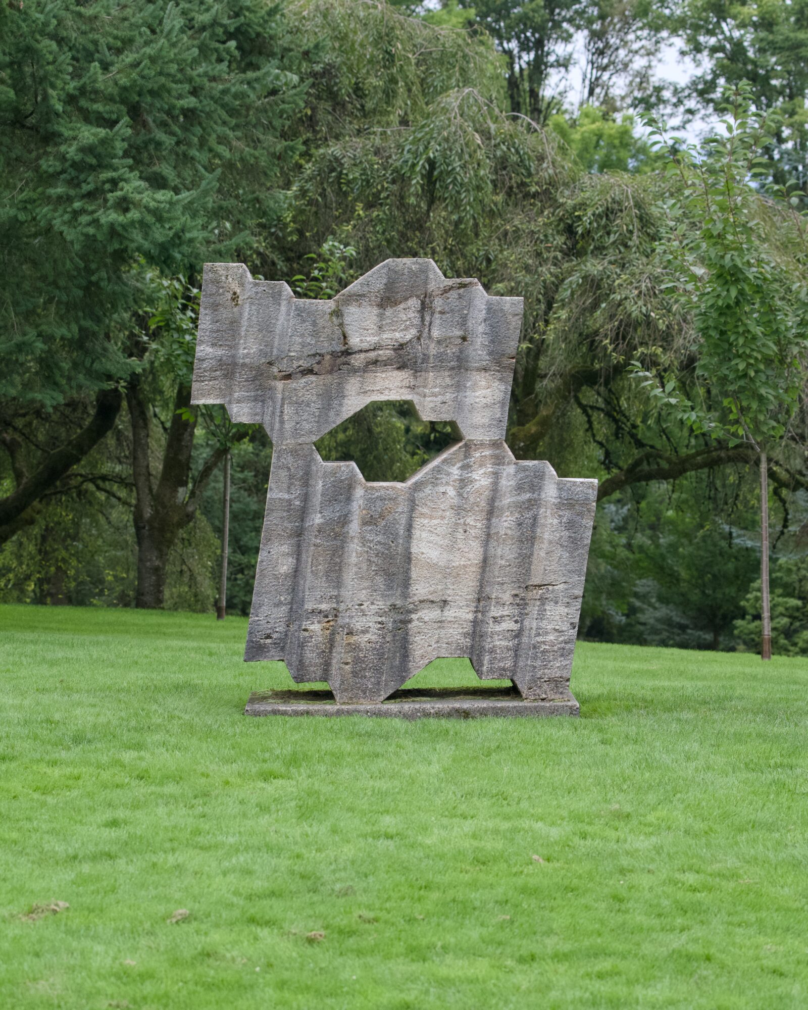 Some abstract stone art piece on a lawn