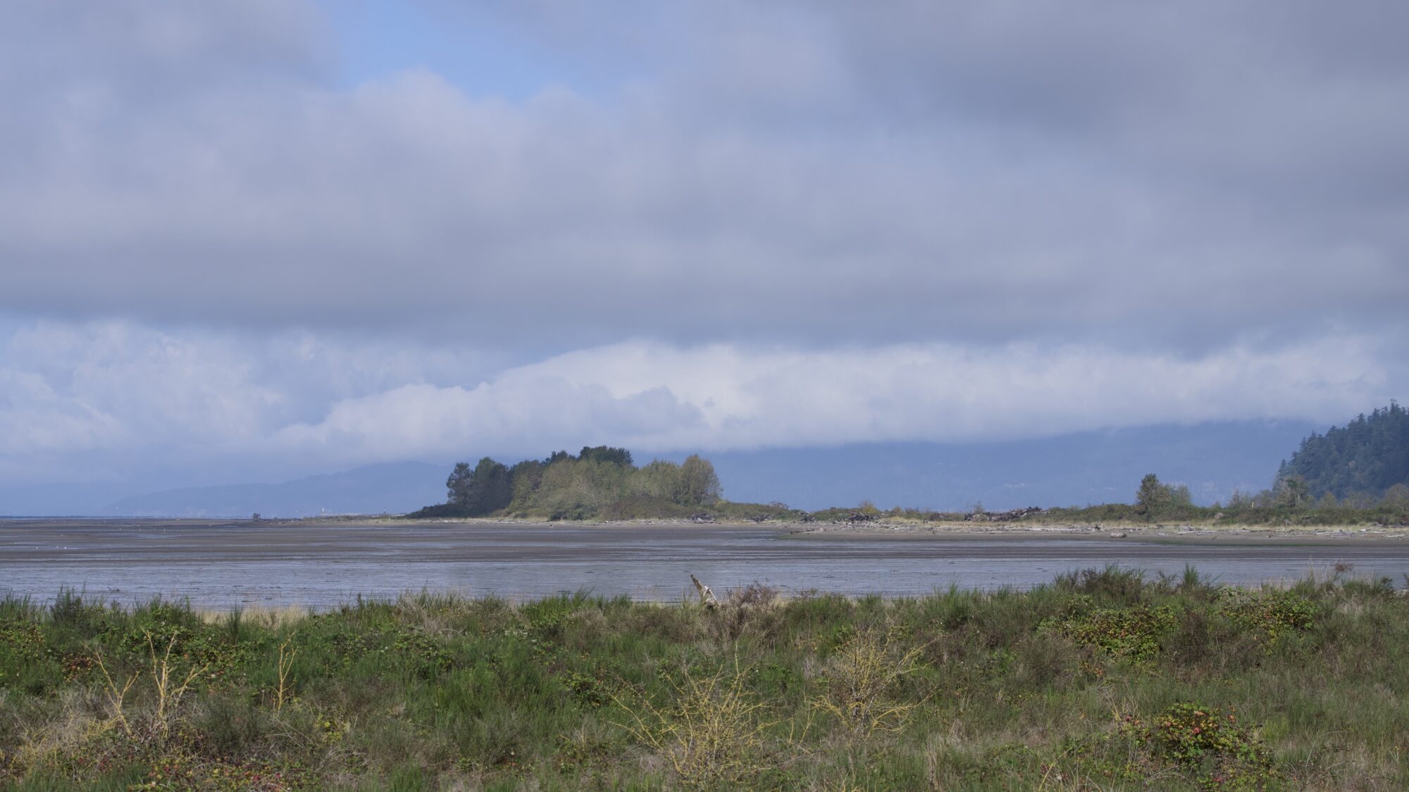 A view of the north jetty under a cloudy sky