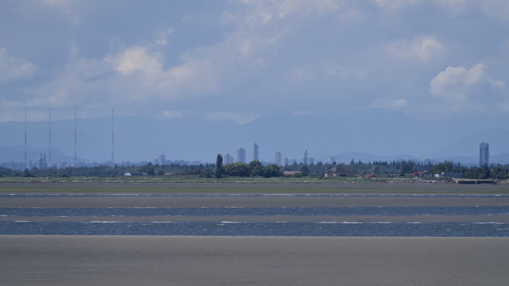View from Crescent Beach, with some wibbly towers in the distance